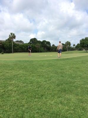 Men on the golf course.