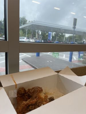 Chicken in the foreground and gasoline in the background