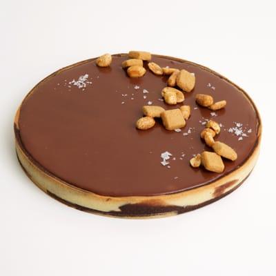 chocolate peanut butter tart with spiced peanuts and maldon salt