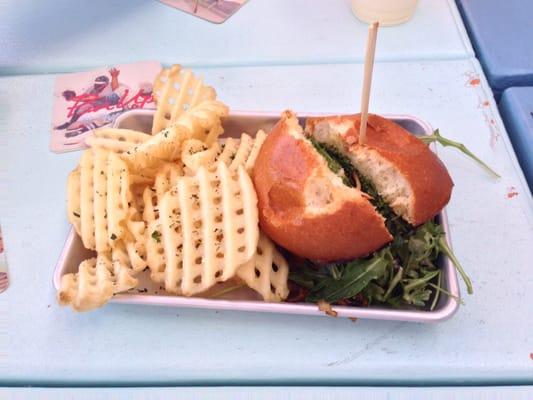 The "Mr. Forest" burger: Sautéed mushrooms, Herb soft cheese and tuxedo arugula with a side of waffle fries.