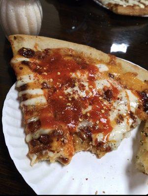 Crazy Chicken Pizza with hot sauce and hot pepper flakes