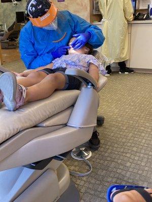 Getting her teeth counted and checked for cavaties