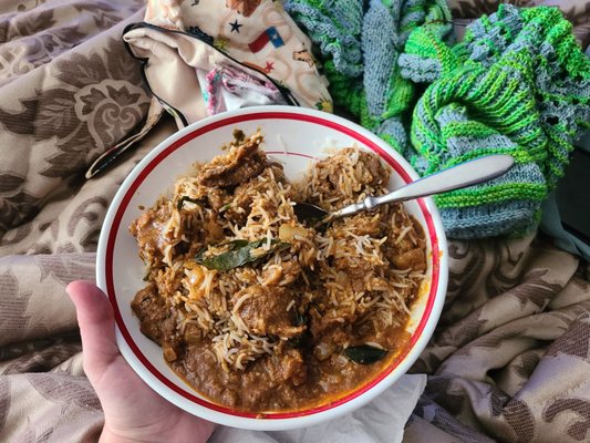 Delivered via Door Dash, piping hot and amazing goat curry with basmati rice. Seriously amazing. (My knitting in the background)