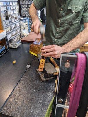 Jacob hammering on my custom belt.