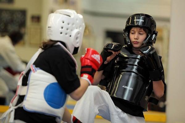 Youth MMA students practicing their skills.