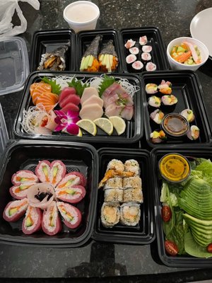 Sashimi dinner, salmon skin HR, spicy salmon HR, yellowtail cut roll, avo salad, shrimp tempura roll, an more