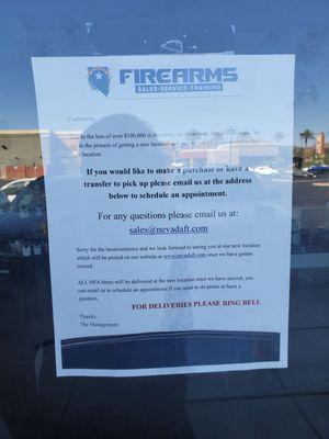 Sign on previous business address stating $100,000 in weapons were lost.