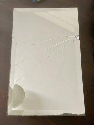 Broken mirror on medicine cabinet