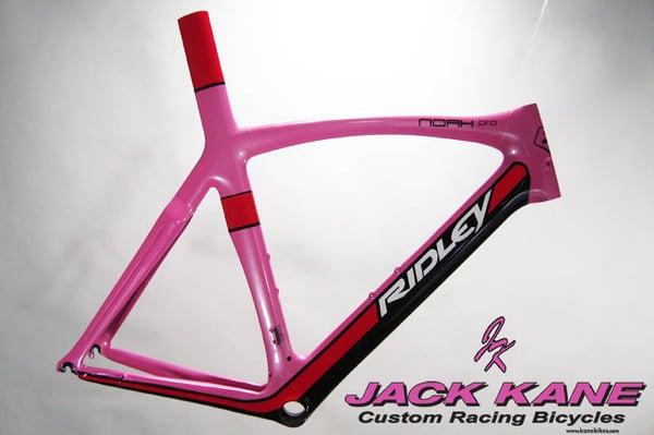 Custom painted Ridley Noah Pro in pink, red, white, and black.