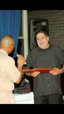 Receiving a plaque from the US Navy Chiefs for my dedication of service