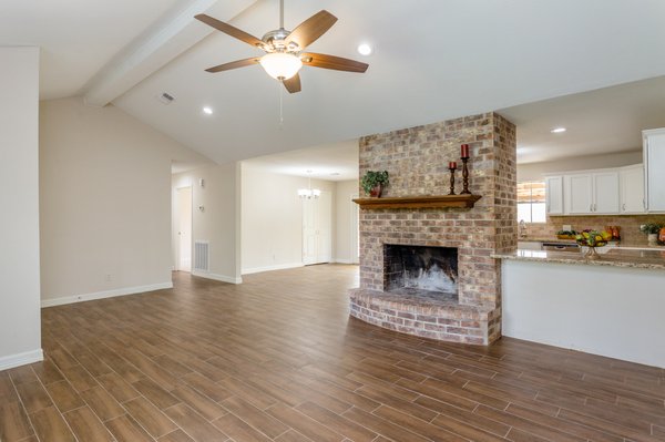 Updated living room. Added bar space, new flooring, paint and front doors.