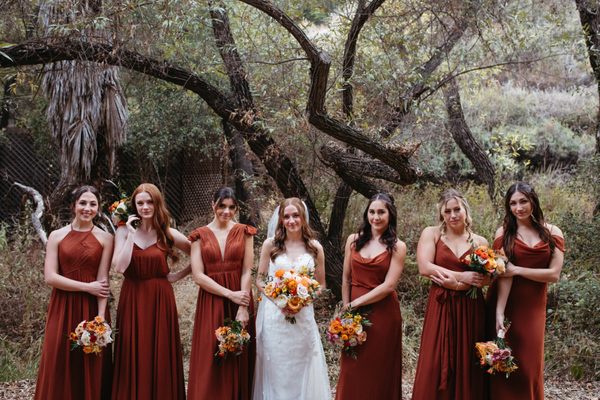 Natural wonder backdrop for a beautiful fall backdrop. Bride and bridesmaids bouquets.