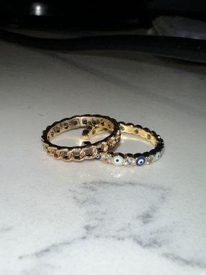 Two rings I purchased. Gold band ($15) evil eye ring ($30). They had a 20% off sale