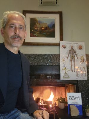 Daniel Rose in front of his cozy fireplace at his home office located at 35 Rockledge Road, Montville, NJ 07045.