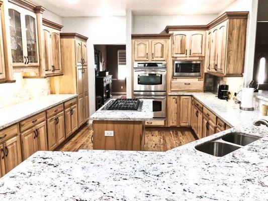 Kitchen Remodeling. Kitchen Renovation. Cabinet Installation. Marble Granite Counter Installation. Stovetop. Hardwood Floor Installation.