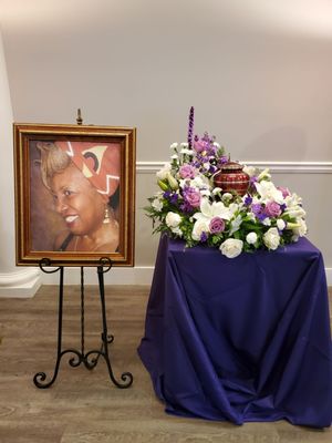 Urn, flowers, and picture frame provided by Forest Lawn.