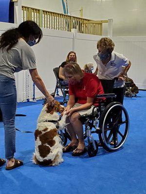 Mex learns how to approach someone in a wheelchair