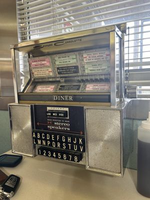 Cute retro jukebox at tables