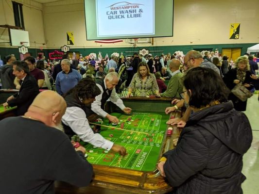 Craps table holds 12 players with 2 dealers.