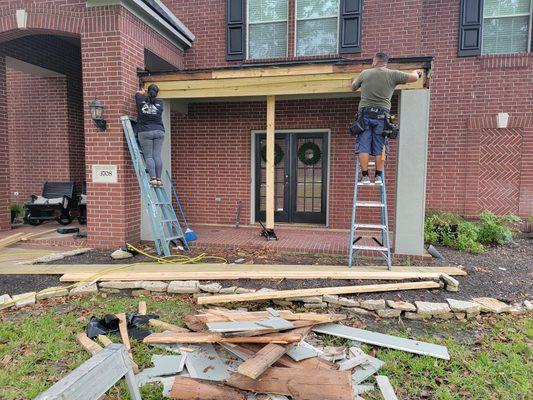 Rebuild front porch & reroof.