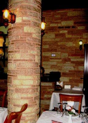 This is a round column covering an ugly structural concrete column. We created a work of art to cover it.