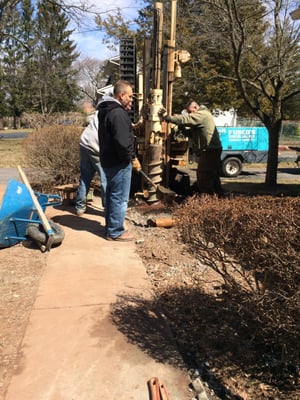 Putting in a test well for water sampling after oil tank removal