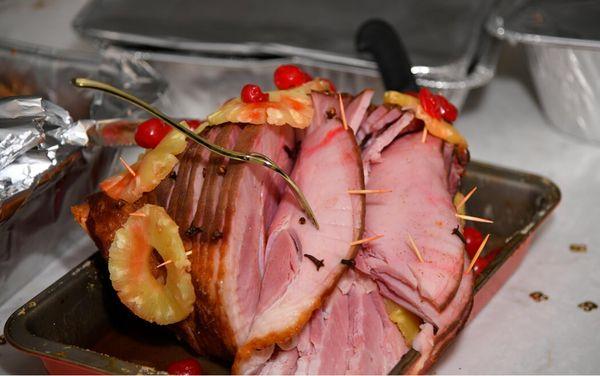 Decorative ham w/ pineapple with a touch of cherries.