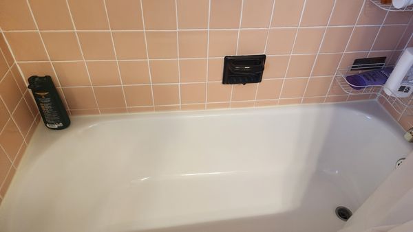 Tub and yellow caulk - caulk should stay white