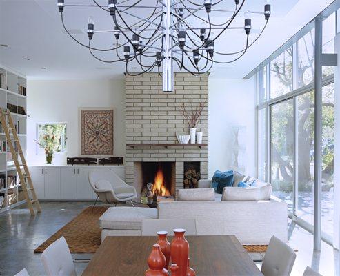 Living room, flooded with daylight and featuring expansive garden views.