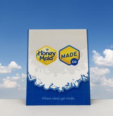 Design for die cut vertical trifold card for food product launch.