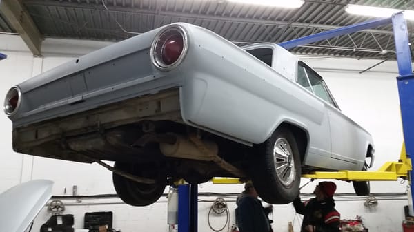 My 64 Fairlane up in the air at I Can Fix This.