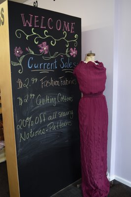 Current sales posted by the front door.