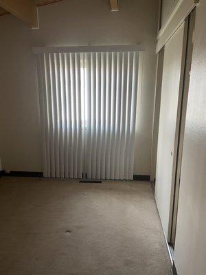 Blinds in larger bedroom that are missing blinds