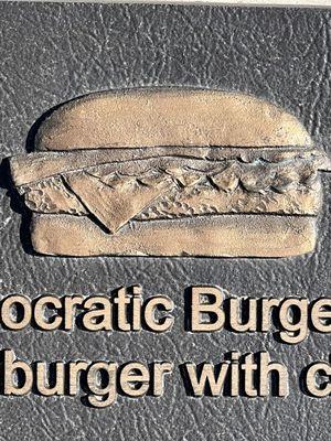 The Birthplace of the Cheeseburger. A bronze plaque on the ground @ the former Rite Spot in Pasadena. In 1924 Lionel Sternberger created it.