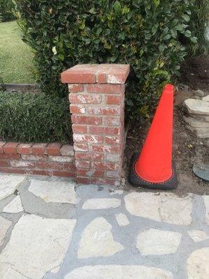 I need to take down and rebuild a new pillar where the cone is and extend the small wall with matching same bricks.