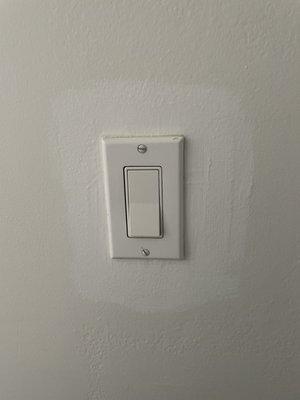 His painter forgot to paint around the light switch he said he could fix it and this is how he fixed it