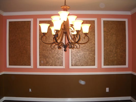 Two toned formal dining room with a metallic faux