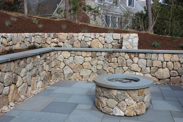 Feildstone retaining wall, bluestone patio, gas fire feature