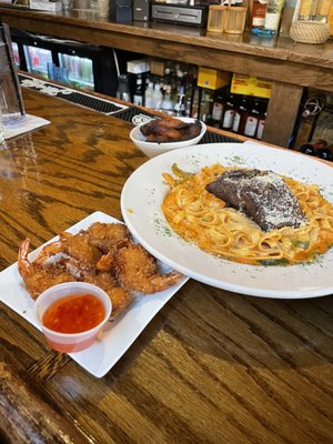 Coconut shrimp and the Rasta Pasta. Pasta is spicy, but awesome!