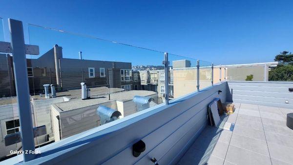 Laminated glass deck rail with post system in San Francisco.