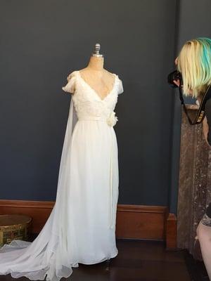 The dress from the front, with the lovely Sarah taking photos for their archival purposes.