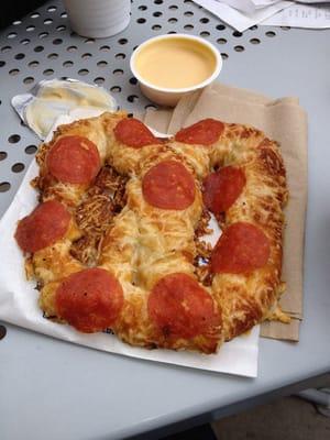 Pepperoni pretzel with hot cheese sauce... Awesome