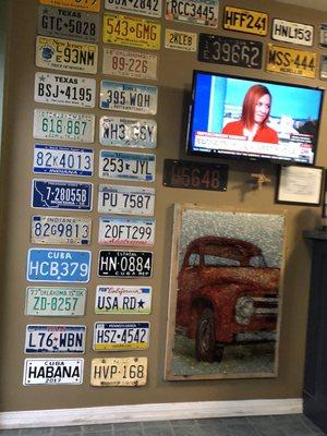 Waiting area. Cool display of license plates.