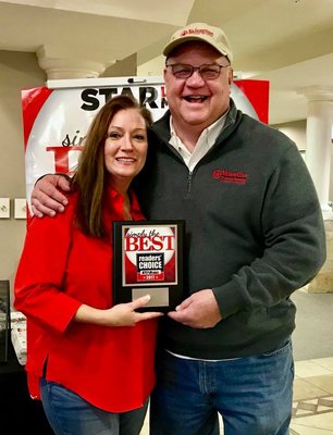 Owners John & Kristi Valentine accept "Best Roofing Co" 4 years in a row