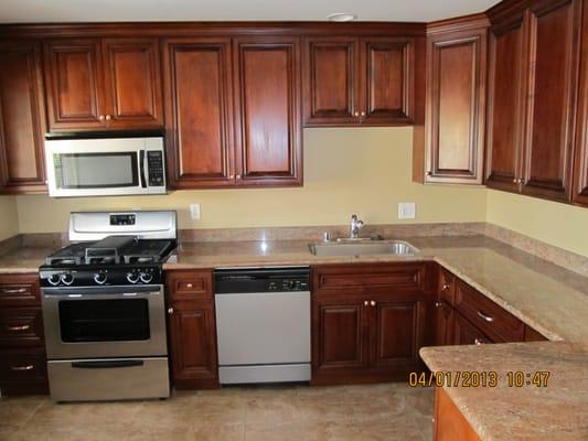 Gorgeous kitchen with custom cabinets and granite counters.