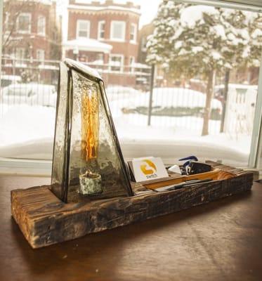 Inspired by winter in Chicago, the Icicle Desk Lamp has a barn wood base and hand blown glass shade.