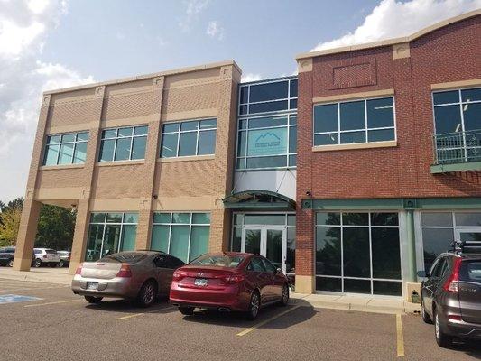 Building facade. The best place to park is on the south side of the building near the park