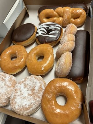 Chocolate long John, glazed, chocolate marble, sugar twist, cinnamon sugar twist, custard, & Bavarian.