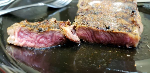 Thin steaks are a challenge with crust vs rare in a home cooking environment, the stove but it was juicy after resting.