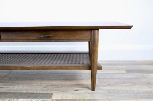 A Vintage Mid Century Modern coffee table with a laminated top